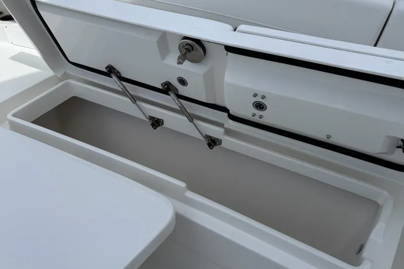 Slide: The Image of Open storage compartment on a 2026 Regulator 31 boat, showcasing interior details. - 27