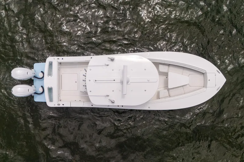 Slide: The Image of Aerial view of 2026 Regulator 31 boat on water, showcasing sleek design and twin engines. - 3