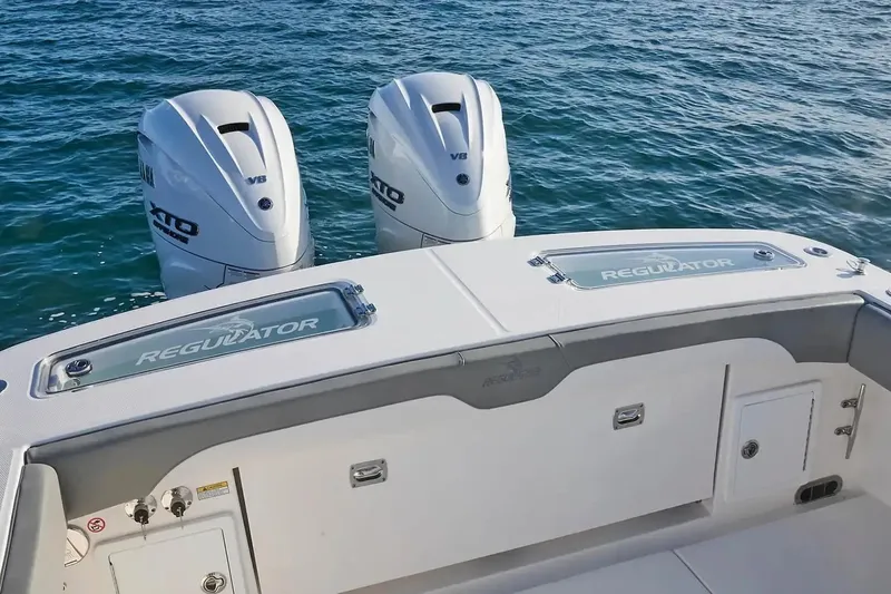 Slide: The Image of Manufacturer Provided Image: 2026 Regulator 31 boat with twin Yamaha V8 engines on the ocean. - 38