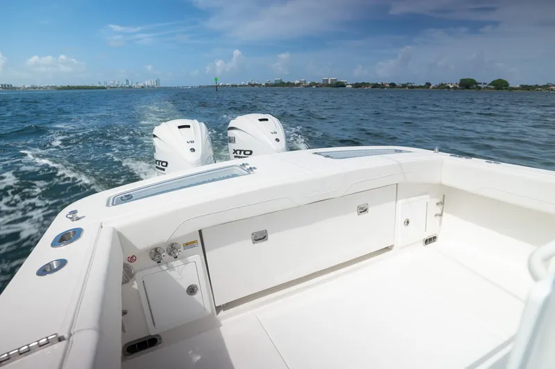 Slide: The Image of 2026 Regulator 31 boat with twin Yamaha XTO engines cruising on open water. - 4