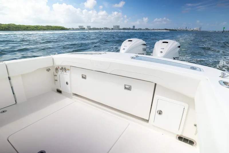 Slide: The Image of 2026 Regulator 31 boat with dual Yamaha engines cruising on open water. - 5