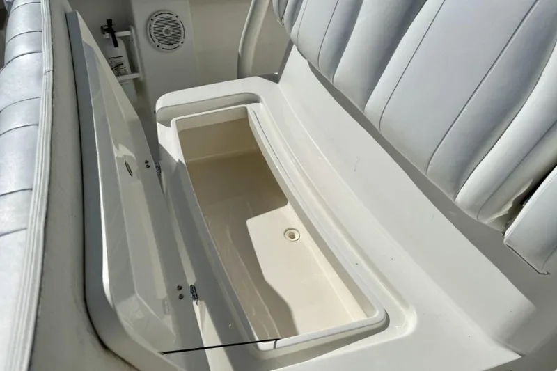 Slide: The Image of 2019 Regulator 31 boat seat with built-in storage compartment, open and empty. - 11