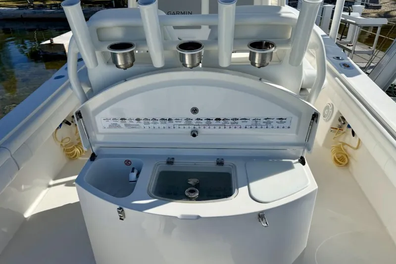 Slide: The Image of 2019 Regulator 31 boat with fishing rod holders and bait station. - 20