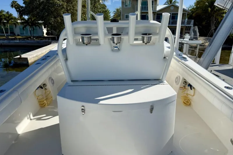 Slide: The Image of 2019 Regulator 31 boat interior with rod holders and storage compartment. - 21