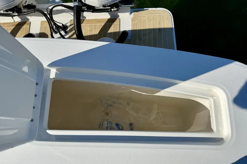 Slide: The Image of Open storage compartment on 2019 Regulator 31 boat deck. - 22