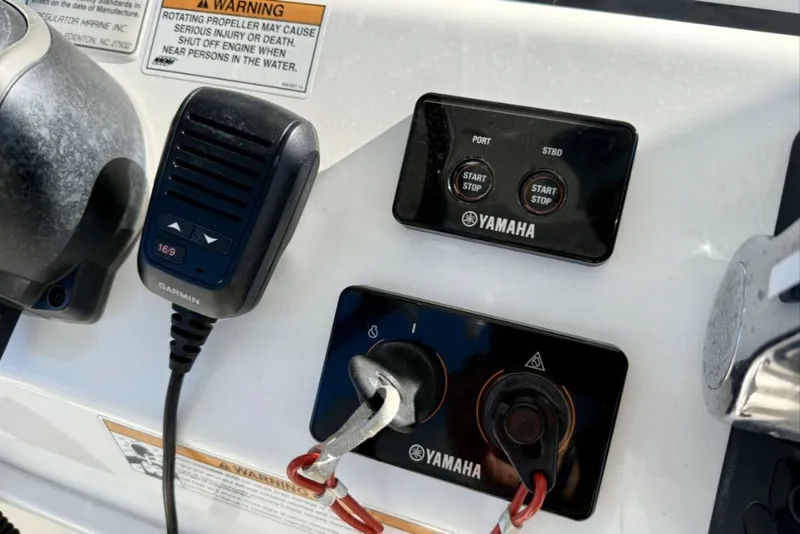 Slide: The Image of Control panel of a 2019 Regulator 31 boat with Yamaha and Garmin equipment. - 33