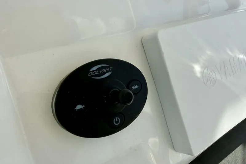 Slide: The Image of Control panel on a 2019 Regulator 31 boat featuring Golight and Yamaha branding. - 34