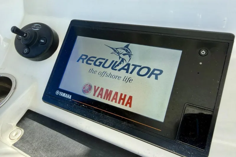 Slide: The Image of Control panel of a 2019 Regulator 31 boat featuring Yamaha display. - 38