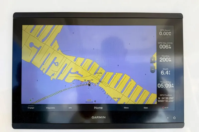 Slide: The Image of Garmin marine GPS display on 2019 Regulator 31 boat, showing navigation map and data. - 41