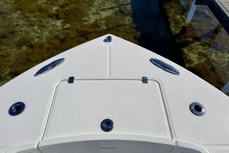 Slide: The Image of Bow of a 2019 Regulator 31 boat, featuring sleek design and stainless steel fittings. - 6