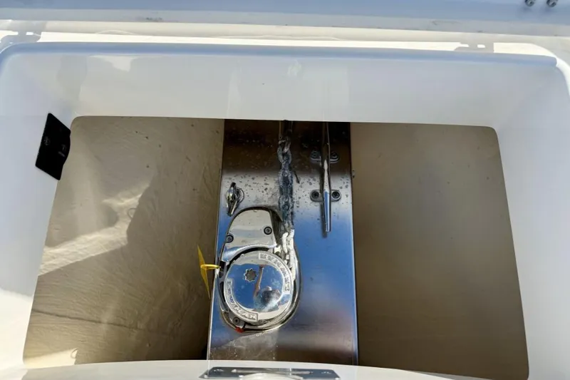 Slide: The Image of Anchor locker of a 2019 Regulator 31 boat, featuring a stainless steel anchor winch. - 7