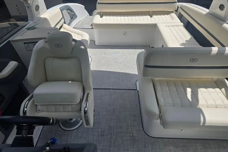 Slide: The Image of 2020 Cobalt R7 Surf boat interior with luxurious white seating and modern design. - 10