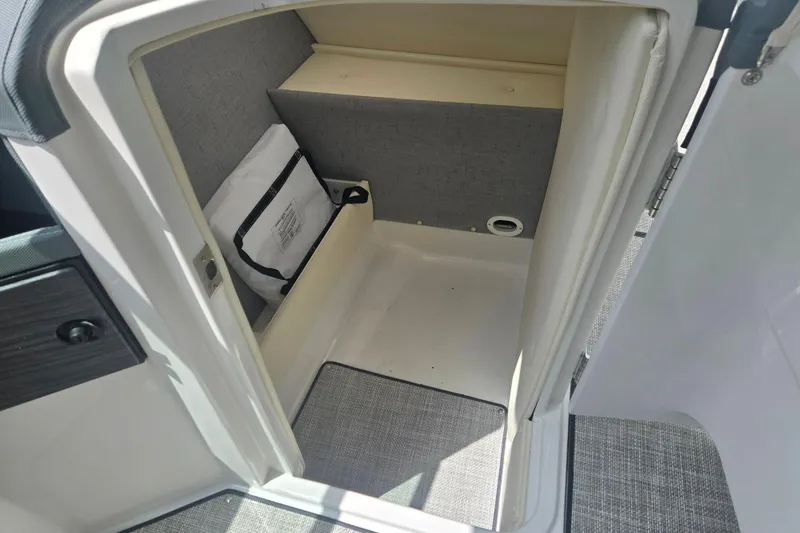 Slide: The Image of Interior storage compartment of 2020 Cobalt R7 Surf boat, featuring clean design and practical space. - 11
