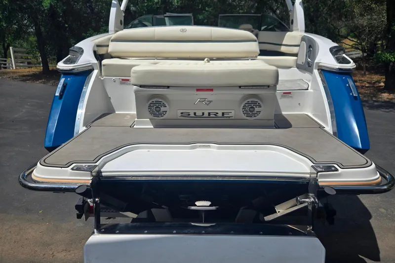 Slide: The Image of 2020 Cobalt R7 Surf boat rear view with swim platform and seating. - 14