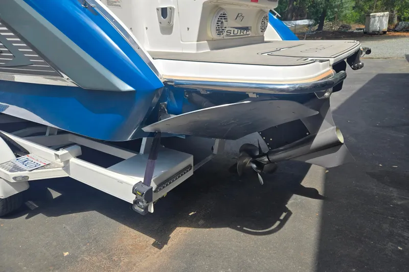 Slide: The Image of 2020 Cobalt R7 Surf boat rear view with propeller and trailer. - 18