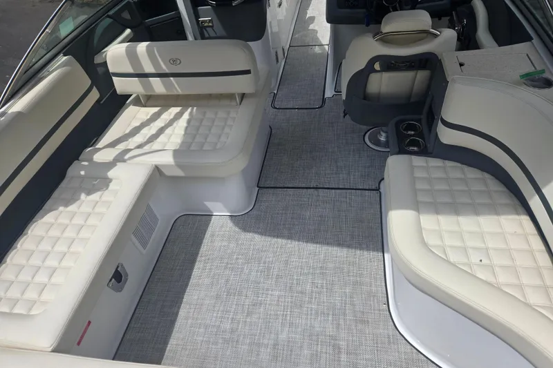 Slide: The Image of 2020 Cobalt R7 Surf boat interior with white cushioned seating and modern design. - 5