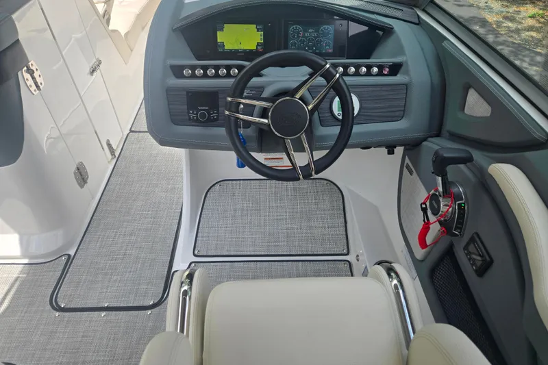 Slide: The Image of 2020 Cobalt R7 Surf boat cockpit with modern steering and control panel. - 7