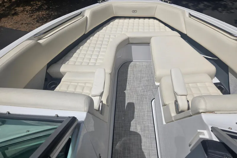 Slide: The Image of 2020 Cobalt R7 Surf boat interior with luxurious white seating and modern design. - 9
