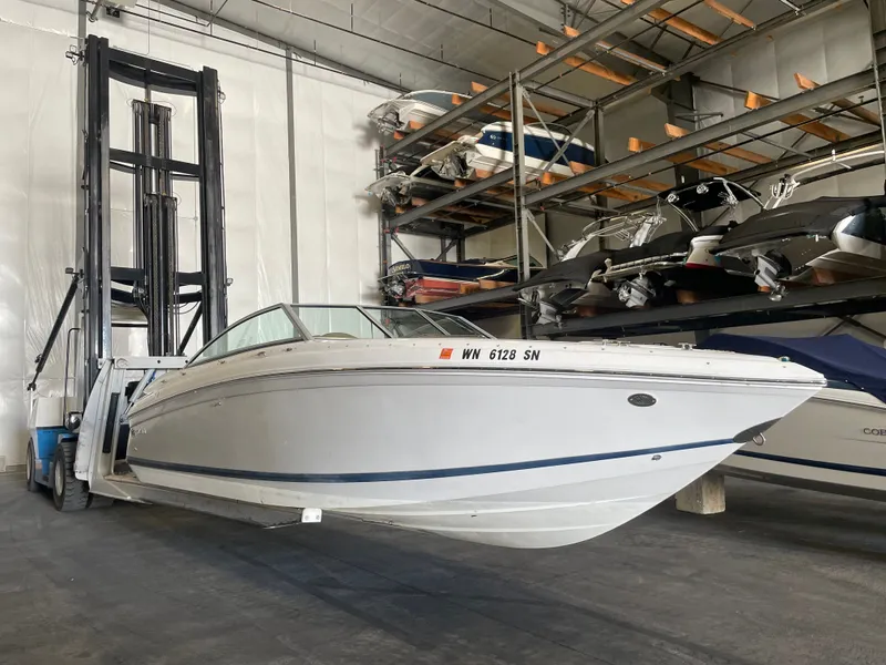 The Image of 2008 Cobalt 252 boat in warehouse on forklift. - 1