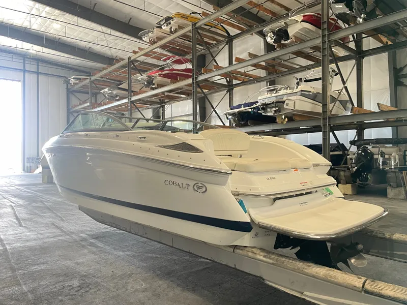 Slide: The Image of 2008 Cobalt 252 boat stored on rack in warehouse. - 4