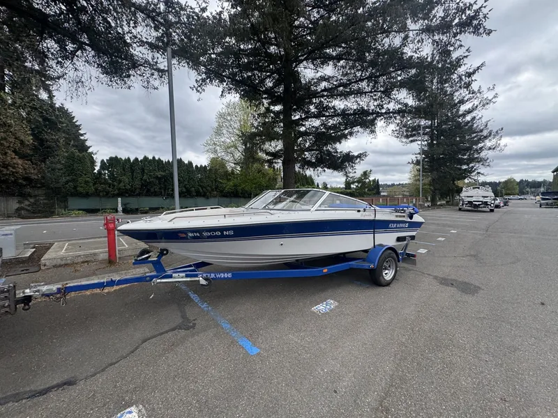 Slide: The Image of 1993 Four Winns 180 Freedom boat parked on trailer outdoors. - 4