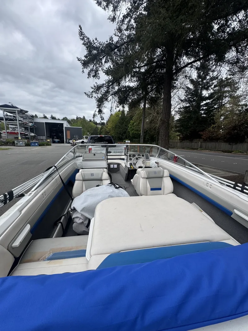 Slide: The Image of Interior view of a 1993 Four Winns 180 Freedom boat outdoors. - 6