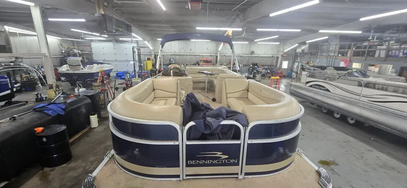 Slide: The Image of 2010 Bennington 2274GLi pontoon boat in workshop. - 2