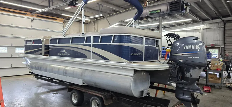 Slide: The Image of 2010 Bennington 2274GLi pontoon boat with Yamaha engine in workshop. - 4