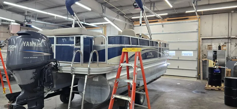 Slide: The Image of 2010 Bennington 2274GLi pontoon boat in workshop with Yamaha engine. - 5