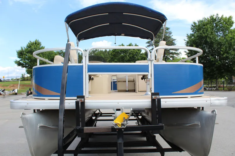 Slide: The Image of 2013 Godfrey SW 2286 FC pontoon boat on trailer, blue hull. - 4