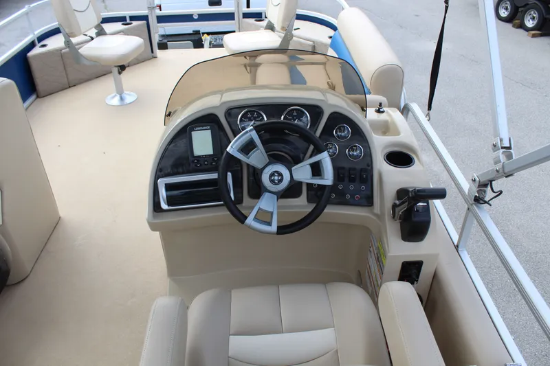 Slide: The Image of Interior view of a 2013 Godfrey SW 2286 FC boat cockpit. - 9