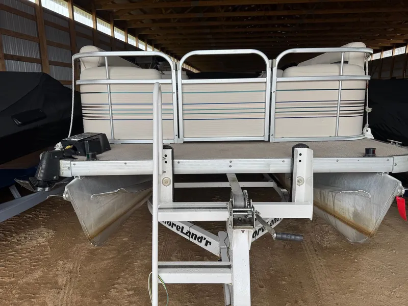 Slide: The Image of 2002 Premier L208 Leisure pontoon boat in storage shed. - 10