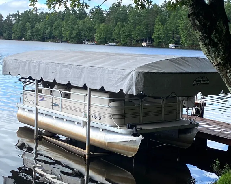 Slide: The Image of Premier L208 Leisure 2002 pontoon boat docked by lakeside. - 11