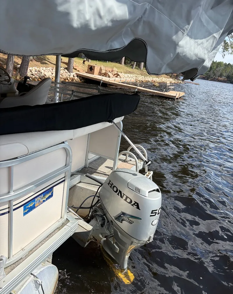 Slide: The Image of 2002 Premier L208 Leisure pontoon boat with Honda outboard motor. - 12