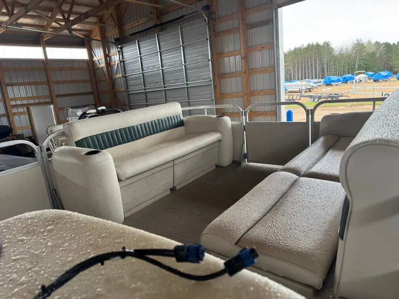 Slide: The Image of Interior of a 2002 Premier L208 Leisure pontoon boat in a barn. - 14