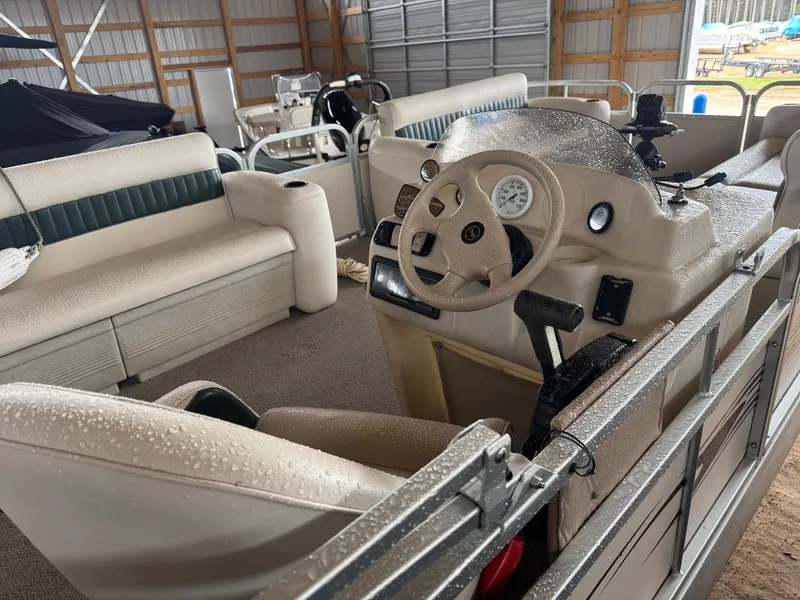 Slide: The Image of Interior of a 2002 Premier L208 Leisure pontoon boat with steering wheel. - 17