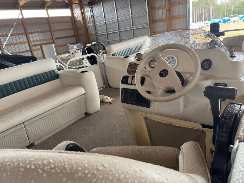 Slide: The Image of Interior of a 2002 Premier L208 Leisure pontoon boat with steering wheel. - 18
