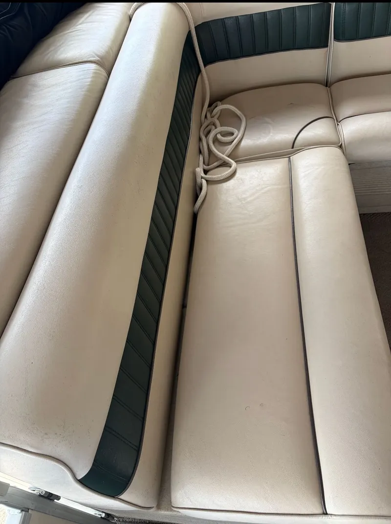 Slide: The Image of Interior of a 2002 Premier L208 Leisure boat with beige seating. - 27
