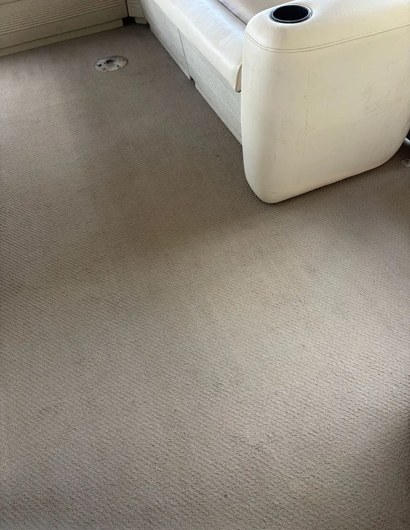 Slide: The Image of Interior of a 2002 Premier L208 Leisure with beige carpet and white sofa. - 28