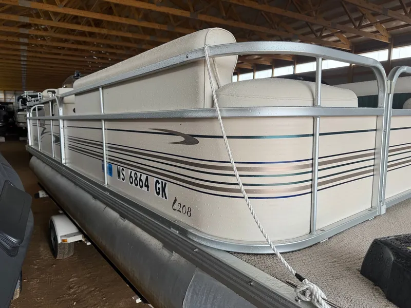 Slide: The Image of 2002 Premier L208 Leisure pontoon boat in storage facility. - 3
