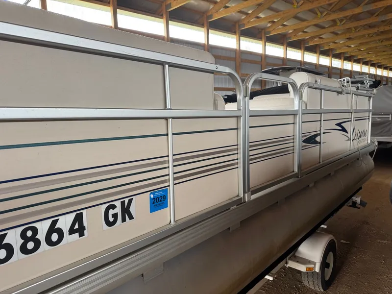 Slide: The Image of 2002 Premier L208 Leisure pontoon boat in storage facility. - 4