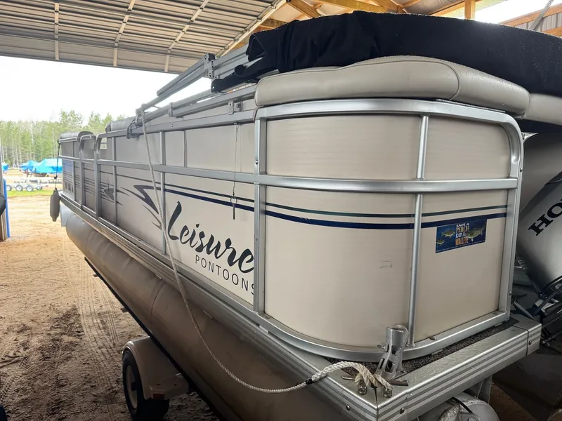 Slide: The Image of 2002 Premier L208 Leisure Pontoon in storage facility. - 6