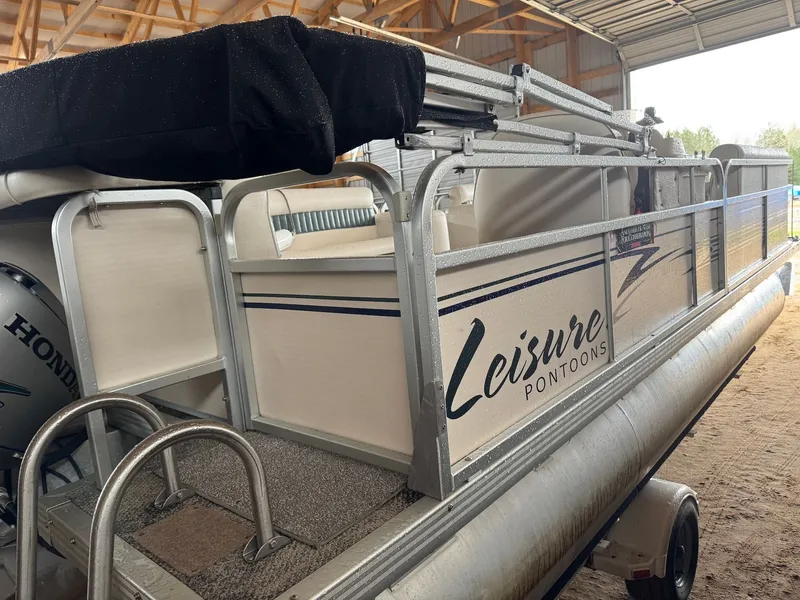 Slide: The Image of 2002 Premier L208 Leisure pontoon boat in storage shed. - 7