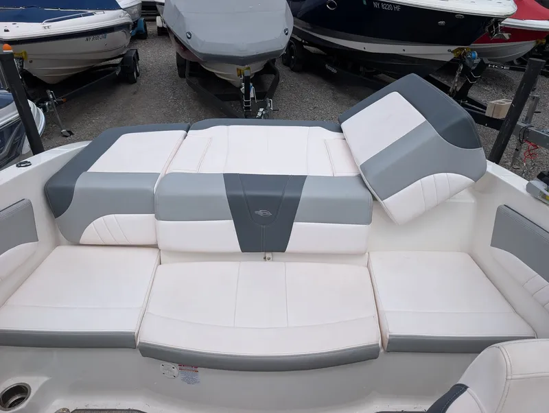 Slide: The Image of Interior of a 2020 Chaparral SSi 210 boat with gray and white seating. - 12