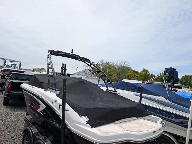 Slide: The Image of 2020 Chaparral SSi 210 boat with cover on trailer. - 15