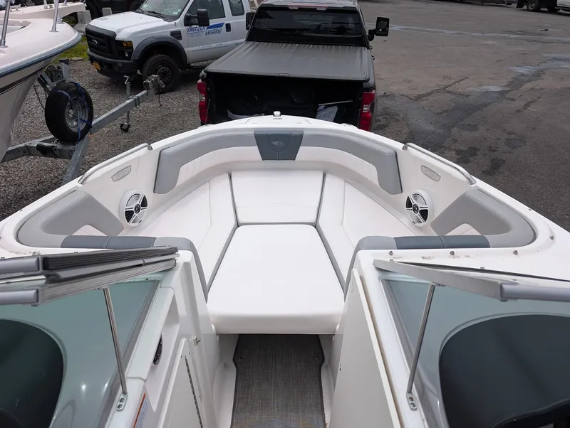 Slide: The Image of Interior view of a 2020 Chaparral SSi 210 boat with white upholstery. - 5