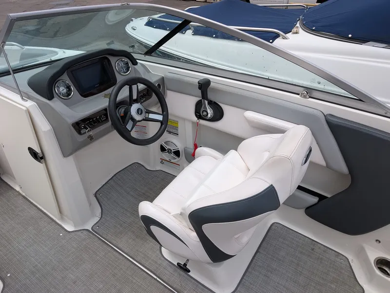 Slide: The Image of Interior of a 2020 Chaparral SSi 210 boat with steering console. - 6