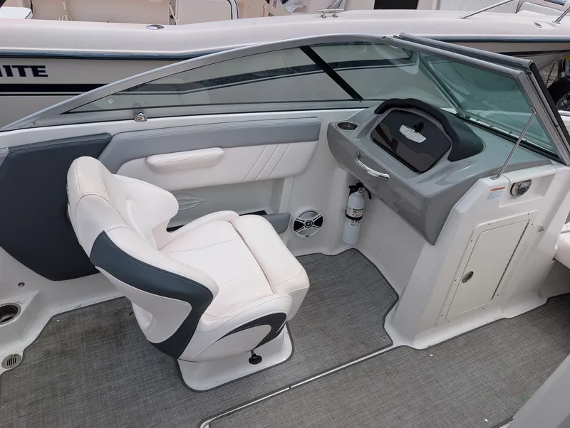 Slide: The Image of Interior of a 2020 Chaparral SSi 210 boat with helm console. - 7