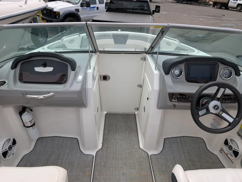 Slide: The Image of Interior view of a 2020 Chaparral SSi 210 boat with helm console. - 8