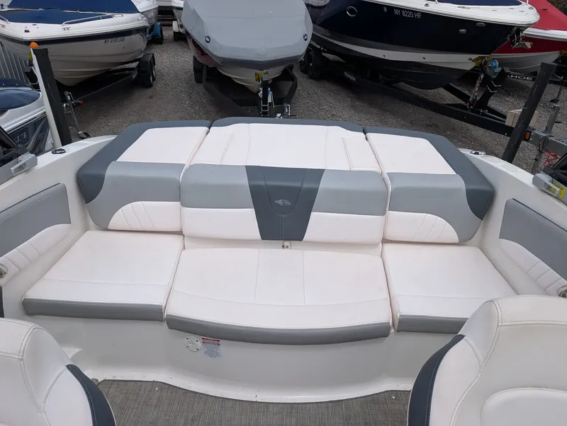 Slide: The Image of Interior of a 2020 Chaparral SSi 210 boat with gray and white seating. - 9